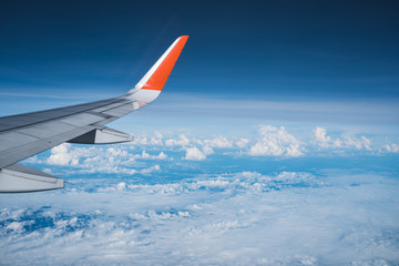 Beautiful view from airplane window and blue sky on nice sunny day, This time in altitude during flight.