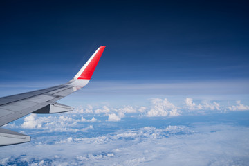 Beautiful view from airplane window and blue sky on nice sunny day, This time in altitude during flight.