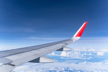 Fototapeta premium Beautiful view from airplane window and blue sky on nice sunny day, This time in altitude during flight.