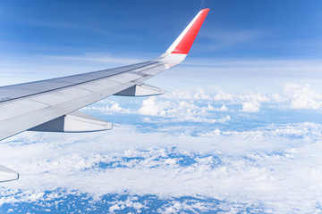 Beautiful view from airplane window and blue sky on nice sunny day, This time in altitude during flight.