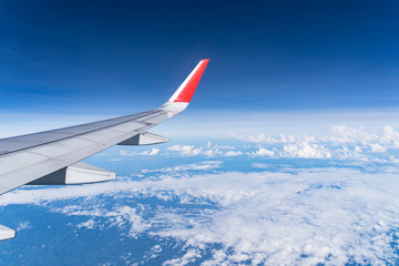 Obraz premium Beautiful view from airplane window and blue sky on nice sunny day, This time in altitude during flight.