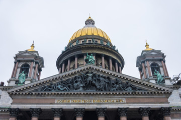 Fototapeta na wymiar The dome of St. Isaac's Cathedral over other historical buildings in the city of St. Petersburg.