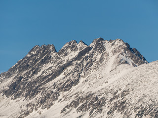 Snow mountains. Panorama of High Tatras. Snow mountains and blue sky.