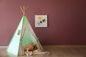 Cozy play tent for kids in child room © Pixel-Shot