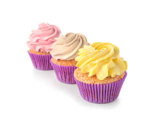 Delicious cupcakes on white background