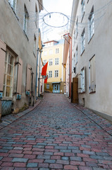 Sloping paving stone street perspective in old town Tallinn