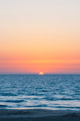 Sunset above Mediterranean sea coast