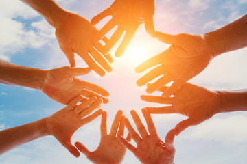 global community of people, support, group of volunteers gathering hands together