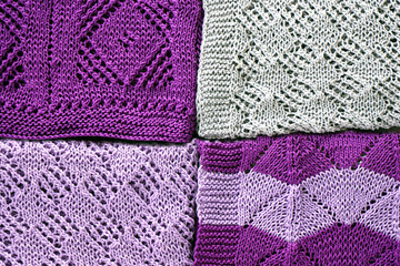 Knitted woolen pattern of  violet and grey background