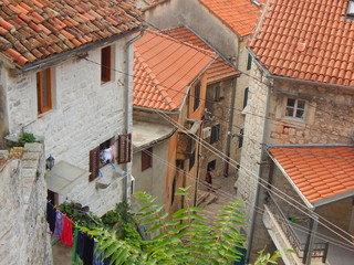 A view to a cute narrow street of the Old Town Kotor.