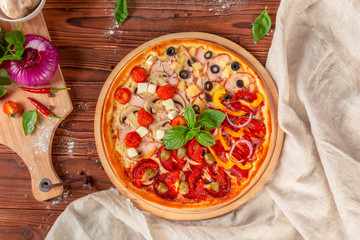 Delicious fresh pizza served on wooden table