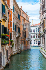 Fototapeta na wymiar Colorful water canal street in Venice Italy