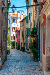 Fototapeta na wymiar Cozy Old Town paving stone street in Rovinj Istria Croatia