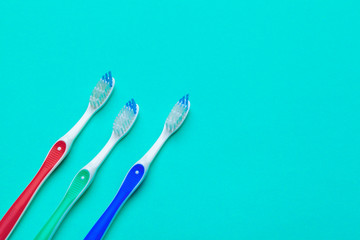 Flat lay composition with manual toothbrushes on color background, close up