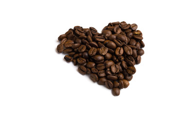 Heart made of coffee beans. Love coffee background isolated.
