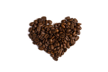 Heart made of coffee beans top view. Love coffee background isolated.