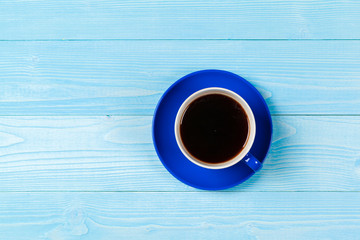 Bright colored coffee cup on a table top view