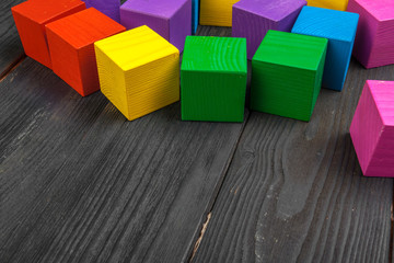 colorful wooden cubes on wooden table