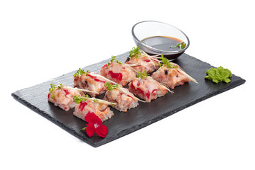 Black rectangle plate with sushi, isolated on white