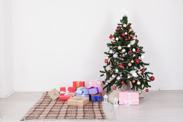 Christmas tree in white interior with toy decor