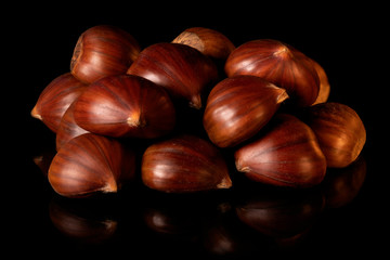 chestnuts on a black background with reflection