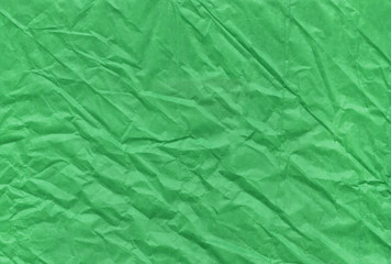 Christmas green crumpled and grungy textured blank paper background