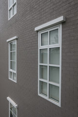 vintage wooden brick wall and white windows