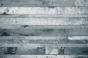 Wooden background from the ends of old boards. Toned