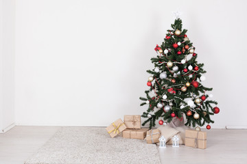 Christmas tree in white interior with toy decor