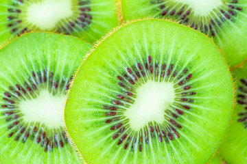 Fresh kiwi fruit slices closeup macro background