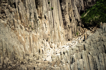 Cape Stolbchaty. Cape on the west coast of the island of Kunashir. It is composed of layers of basaltic lavas of the Mendeleyev volcano.