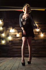 Young girl posing on the background of lights