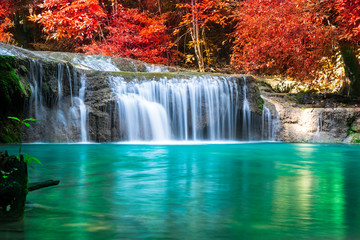Fototapeta na wymiar Amazing in nature, wonderful waterfall at autumn forest in fall season. 