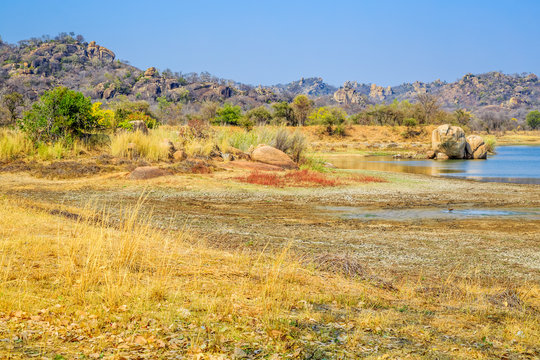 View of a lake surrounded by rocks, in Matobo National Park, Zimbabwe. September 26, 2016.