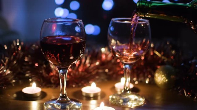 wine glasses. Light garlands in the background. Celebration. Evening time of day. Hd