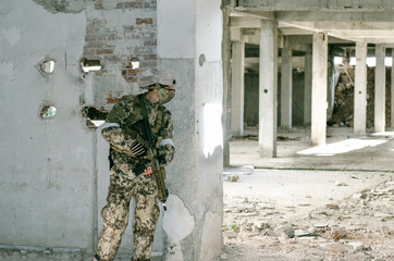 Soldier inside building cover on wall