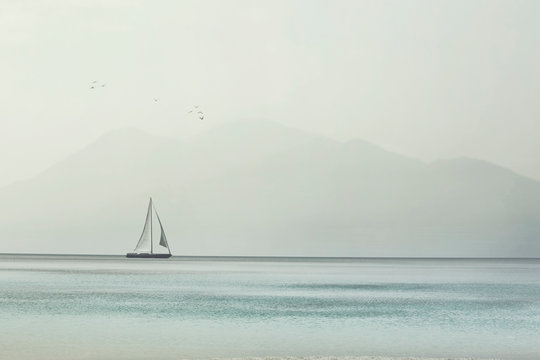 sailboat glides lightly on the waves of a pristine ocean