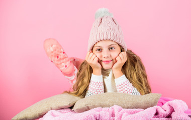 Obraz na płótnie Canvas Kid girl knitted hat and scarf. Winter accessory concept. Girl long hair dream pink background. Winter season concept. Kid dreamy wear knitted hat. Winter rest and relax. Winter fashion accessory