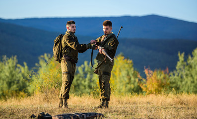 Men bearded hunters with rifle nature background. Experience and practice lends success hunting....