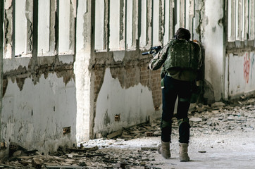 Airsoft uniform man back view insidebuilding