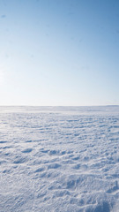 A Field covered with a snow in winter season. Winter countryside landscape.