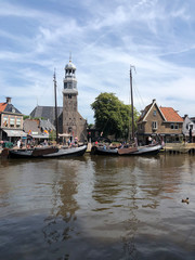 Sailboats in the canal of Lemmer,