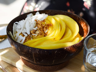 Mango smoothie bowl. Fresh breakfast
