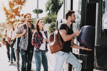 Group of Young People Boarding on Travel Bus