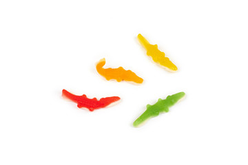 jelly candies in the crocodile shape isolated on white background.