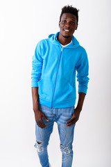 Fototapeta premium Studio shot of young happy black African man smiling and standin