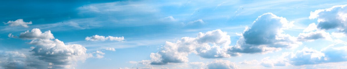 Naklejka na ściany i meble Cloudy weather. Blue sky with grey and clouds. panorama