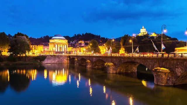 Church of Gran Madre di Dio Turin italy and Santa Maria del Monte dei Cappuccini,Chiesa della Gran Madre di Dio, day to night skyline timelapse view of bridge and river in turin at night.