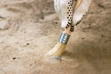 archeology female hand holds brush a tassel excavation of rare materials treasure hunt and...