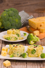 Potato gratins with broccoli florets.